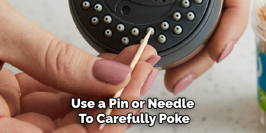 Use a Pin or Needle to Carefully Poke