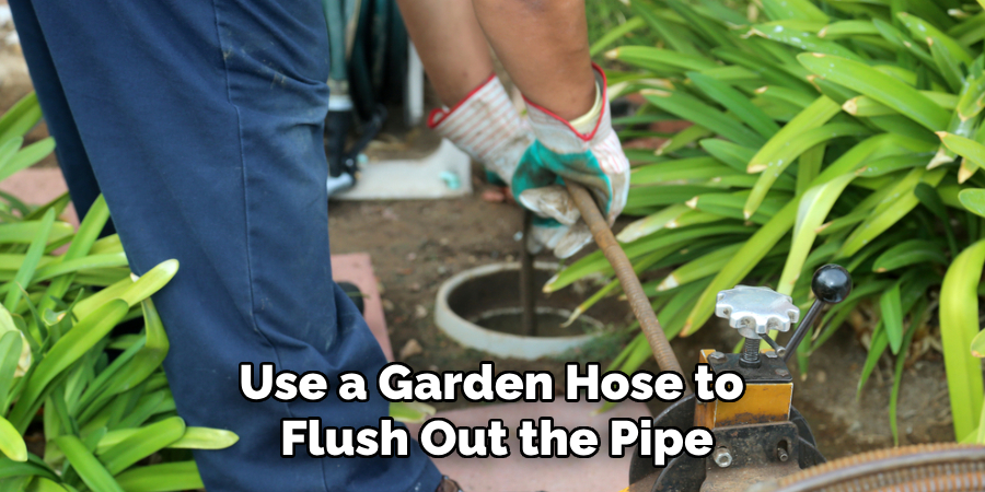 Use a Garden Hose to Flush Out the Pipe