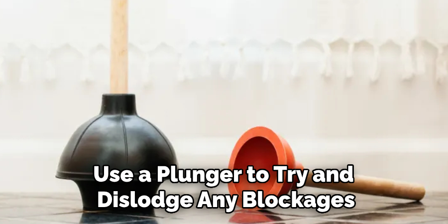 Use a Plunger to Try and Dislodge Any Blockages