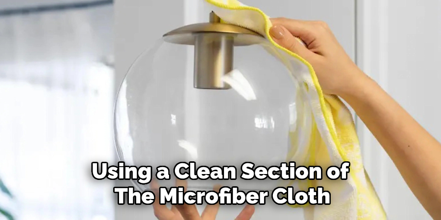 Using a Clean Section of the Microfiber Cloth