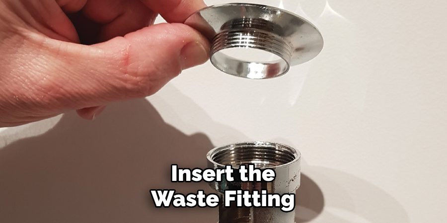 Insert the Waste Fitting