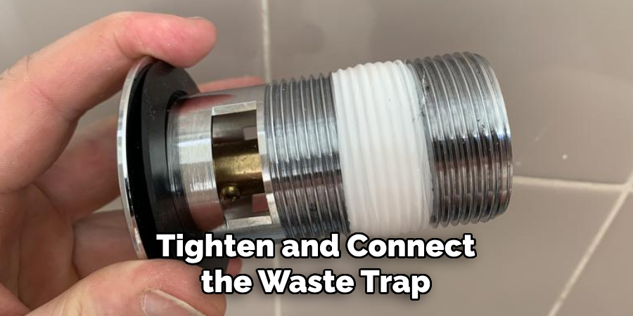 Tighten and Connect the Waste Trap