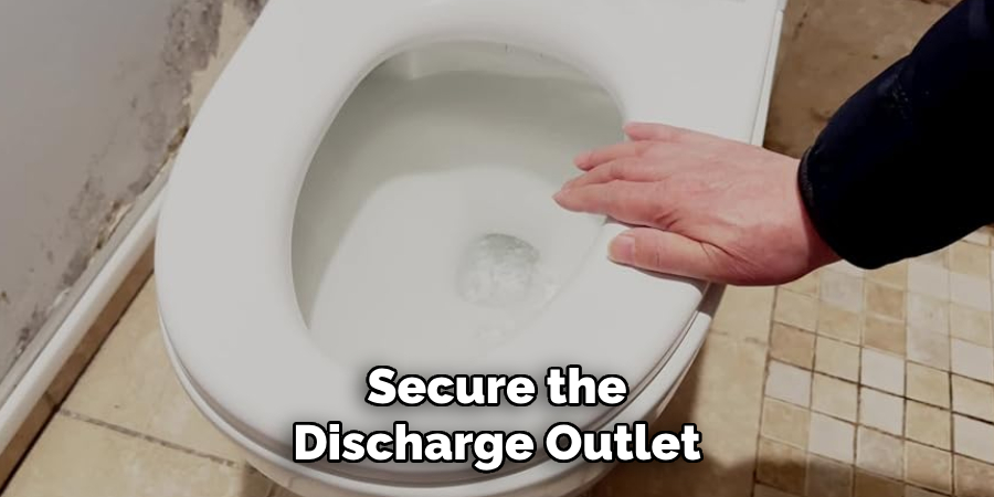 Secure the Discharge Outlet