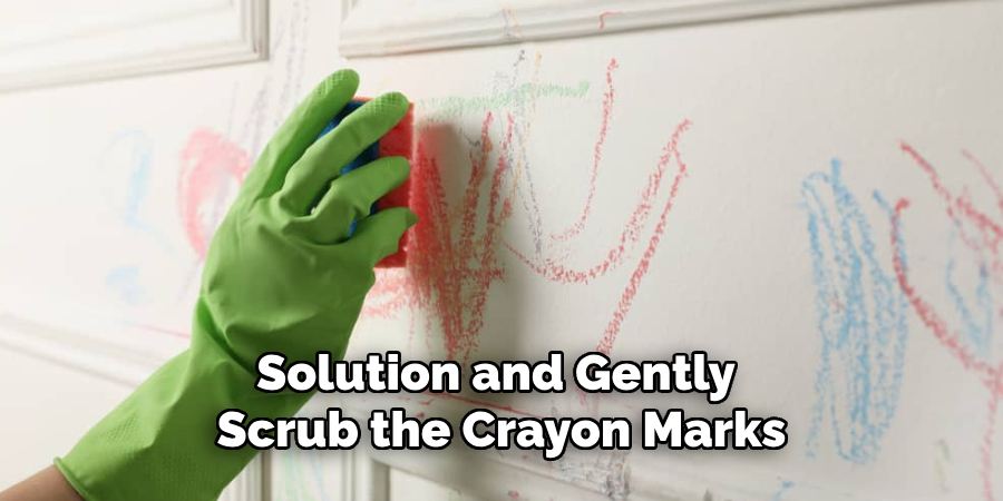 solution and gently scrub the crayon marks