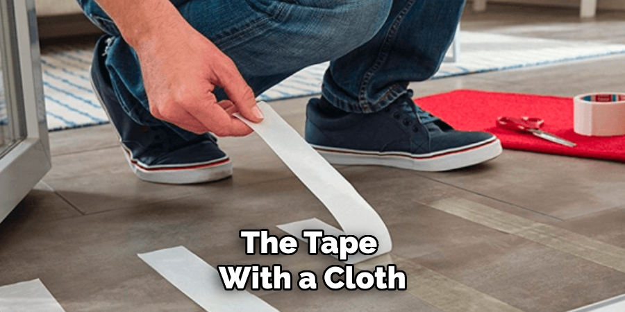 the tape with a cloth