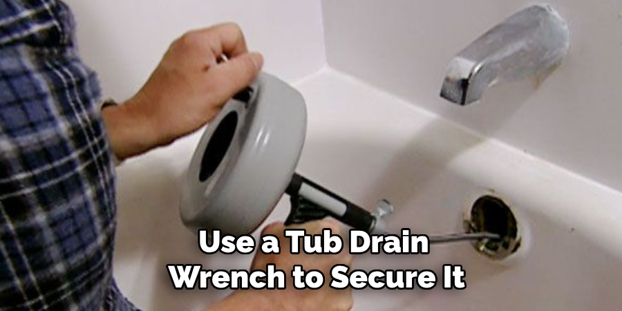 Use a Tub Drain
 Wrench to Secure It