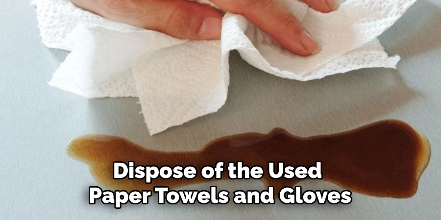 Dispose of the Used 
Paper Towels and Gloves