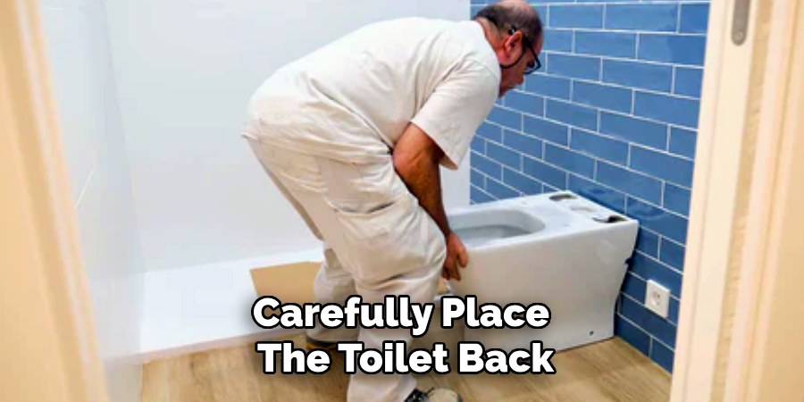 Carefully Place
The Toilet Back