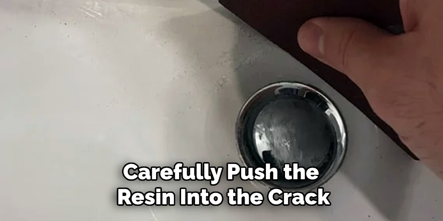 Carefully Push the
Resin Into the Crack