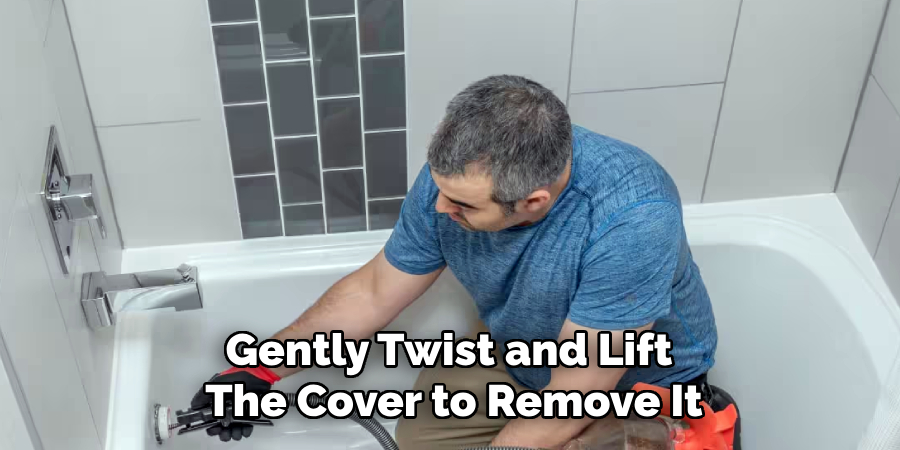 Gently Twist and Lift 
The Cover to Remove It