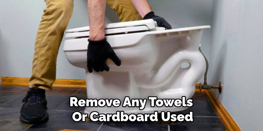 Remove Any Towels
Or Cardboard Used