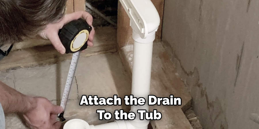 Attach the Drain To the Tub