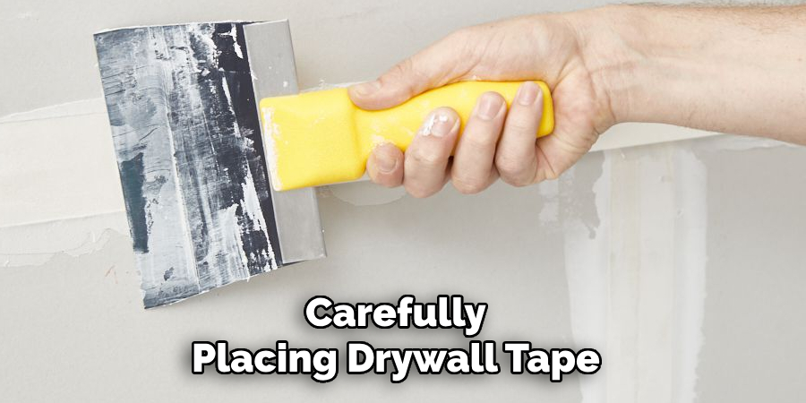 Carefully Placing Drywall Tape