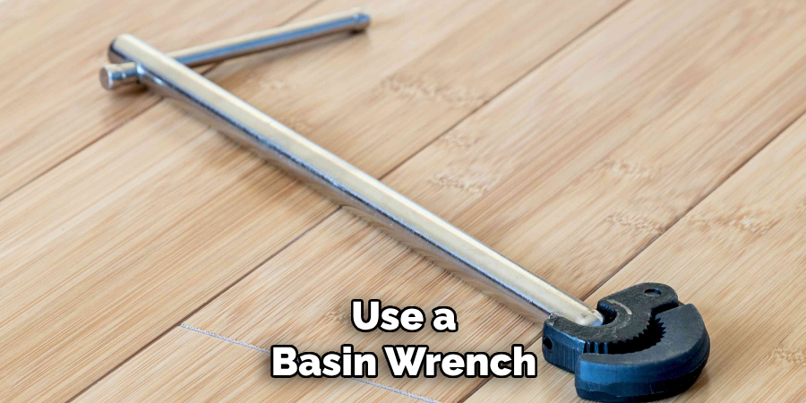 Use a
Basin Wrench