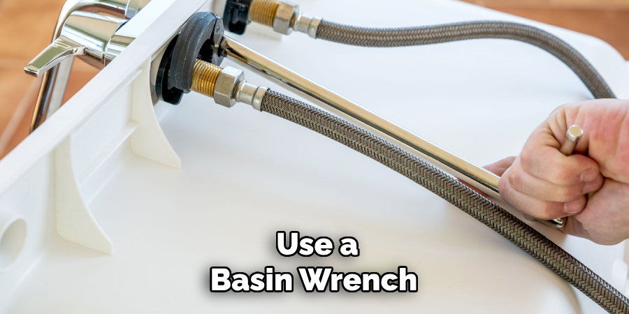 Use a
Basin Wrench
