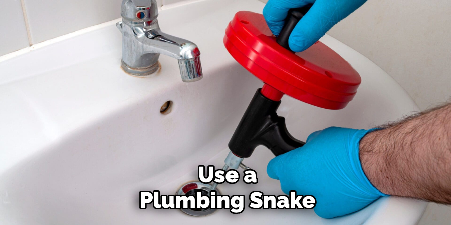 Use a
Plumbing Snake