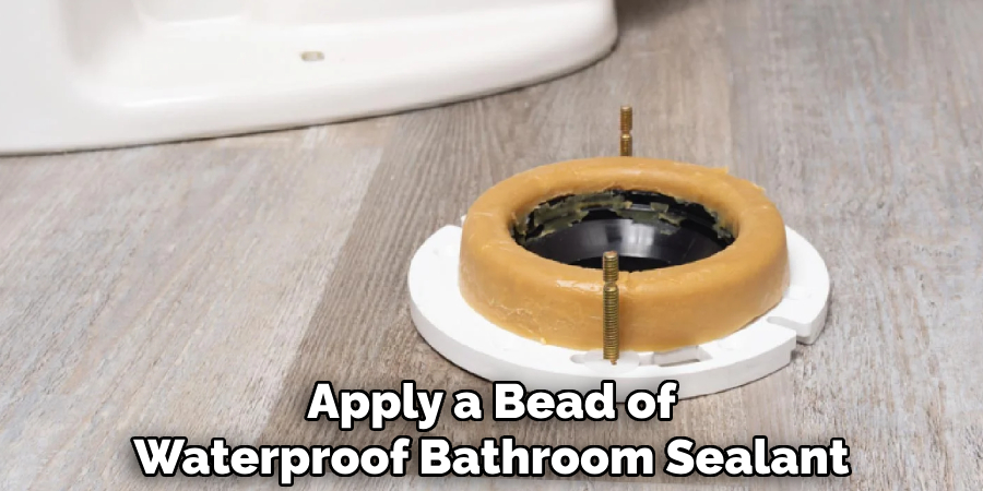 Apply a Bead of
Waterproof Bathroom Sealant