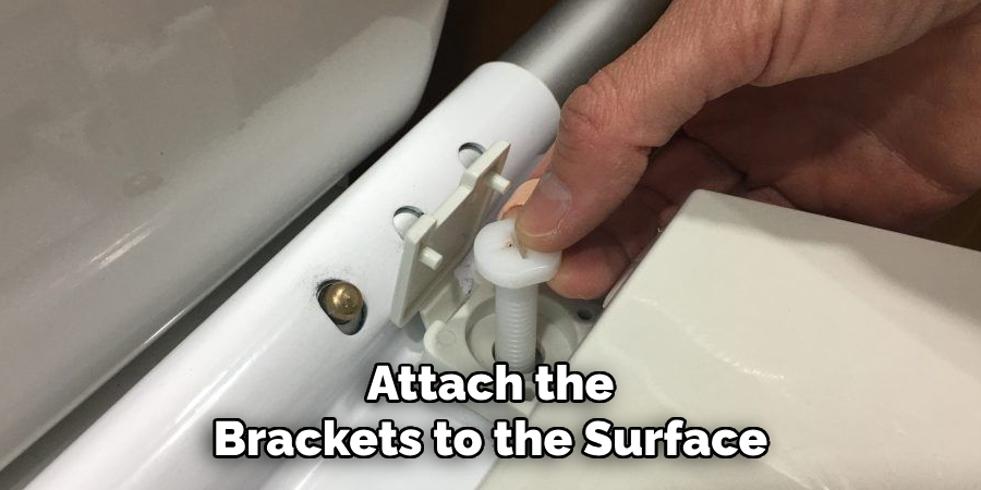 Attach the Brackets to the Surface