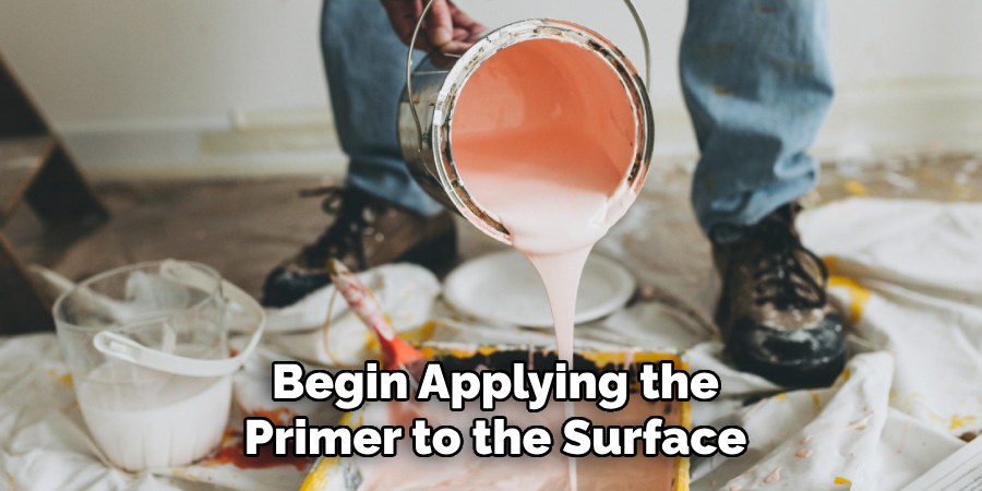 Begin Applying the Primer to the Surface
