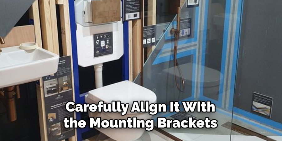 Carefully Align It With the Mounting Brackets