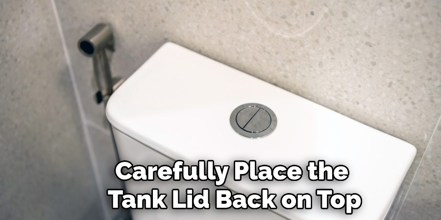 Carefully Place the 
Tank Lid Back on Top