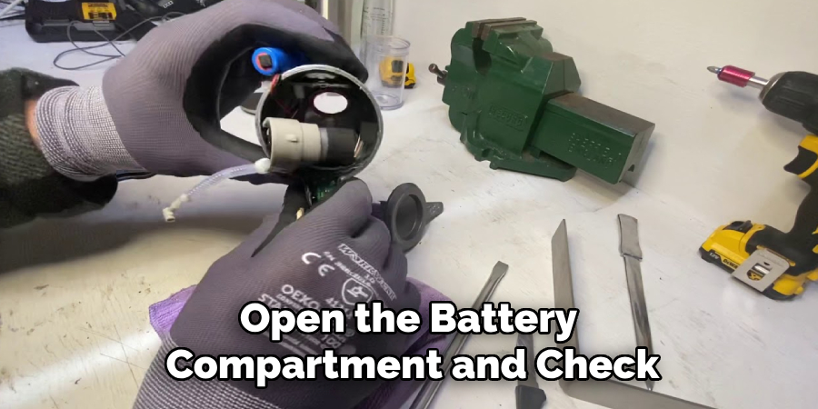 Open the Battery 
Compartment and Check