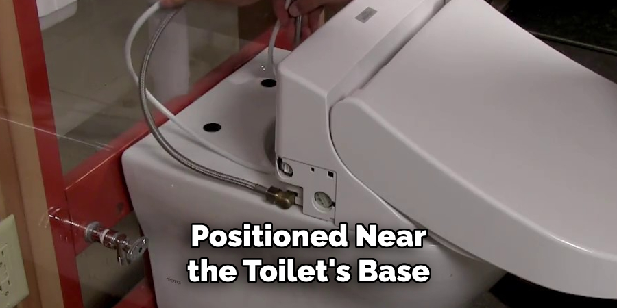 Positioned Near the Toilet's Base