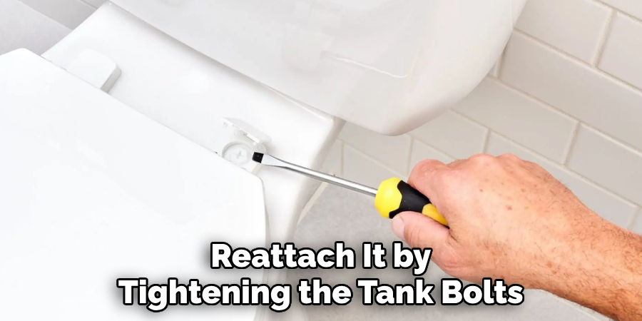 Reattach It by
Tightening the Tank Bolts