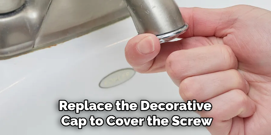Replace the Decorative 
Cap to Cover the Screw

