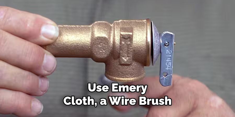 Use Emery Cloth, a Wire Brush
