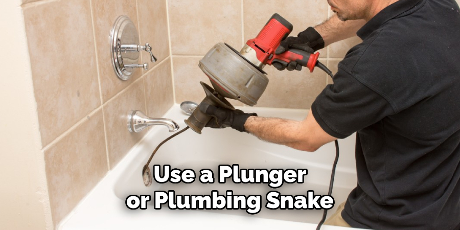 Use a Plunger or Plumbing Snake