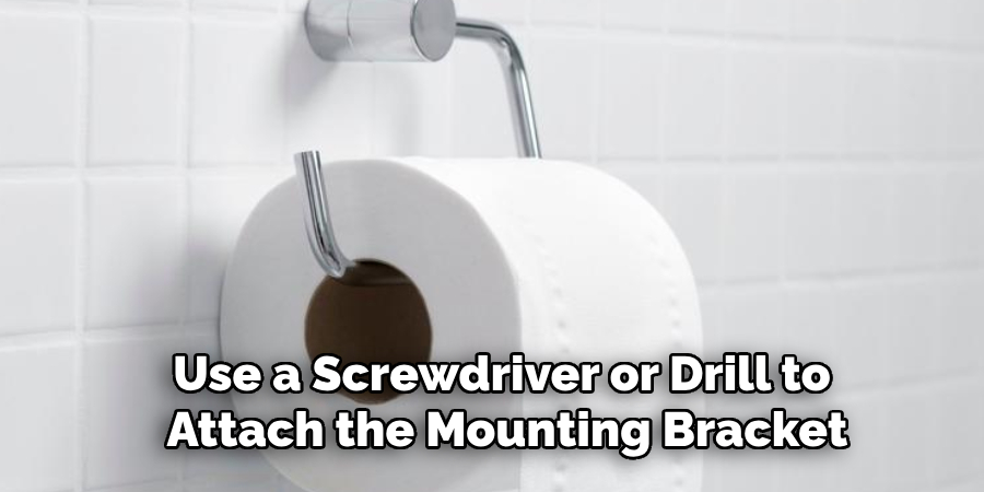 Use a Screwdriver or Drill to
Attach the Mounting Bracket