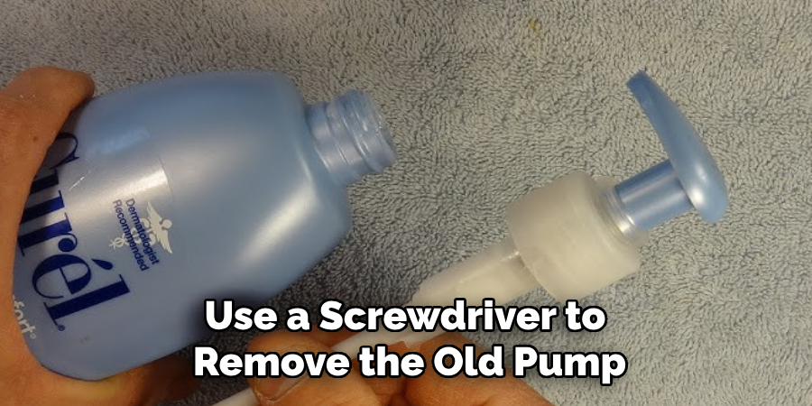 Use a Screwdriver to  Remove the Old Pump