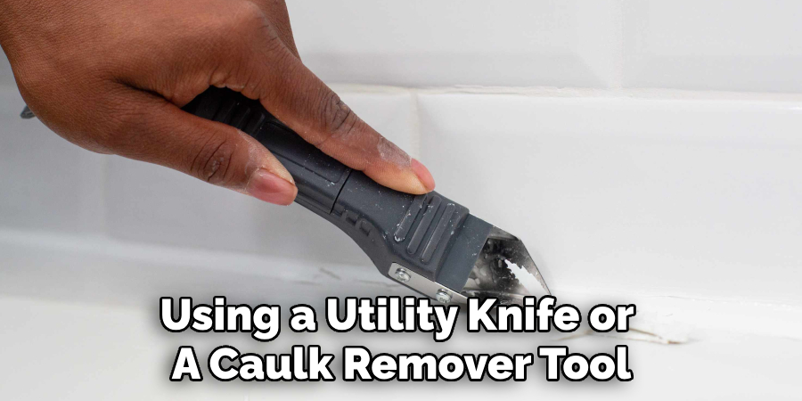Using a Utility Knife or 
A Caulk Remover Tool
