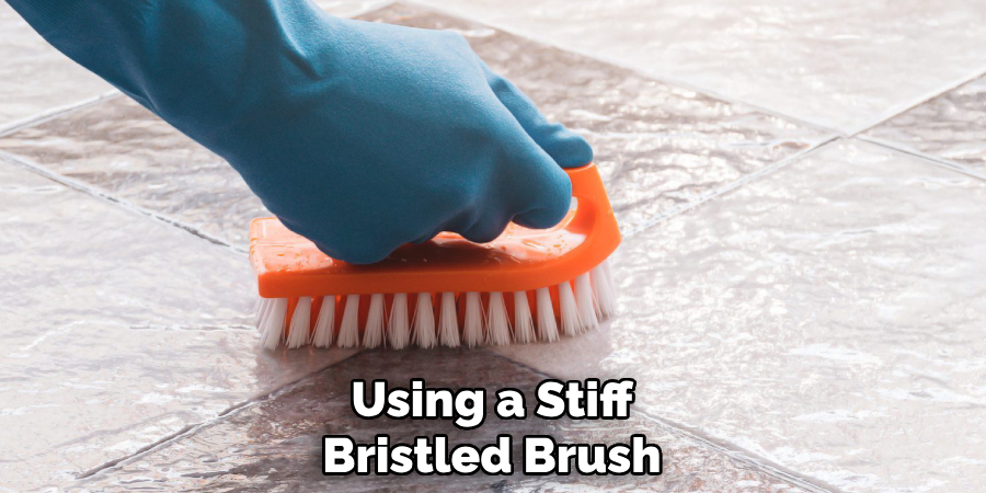 Using a Stiff
Bristled Brush