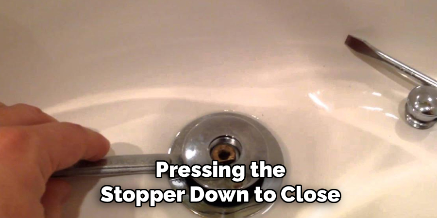 Pressing the Stopper Down to Close