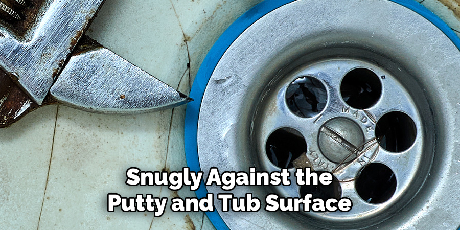 Snugly Against the Putty and Tub Surface