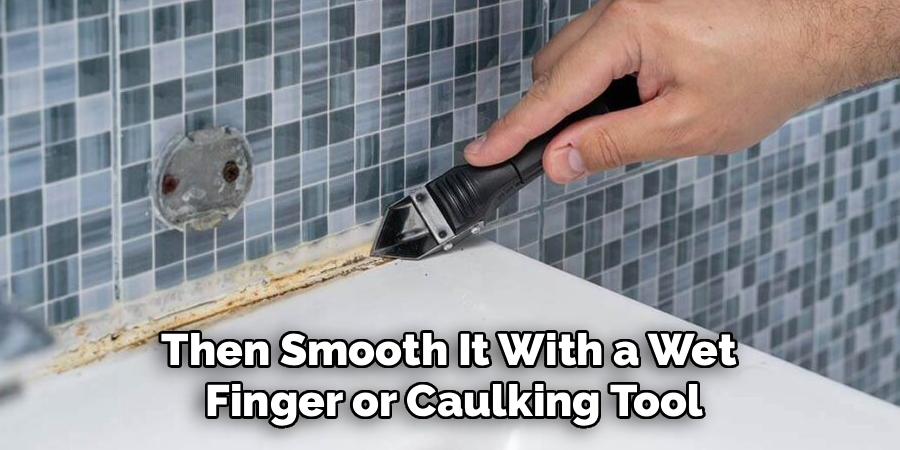 Then Smooth It With a Wet 
Finger or Caulking Tool
