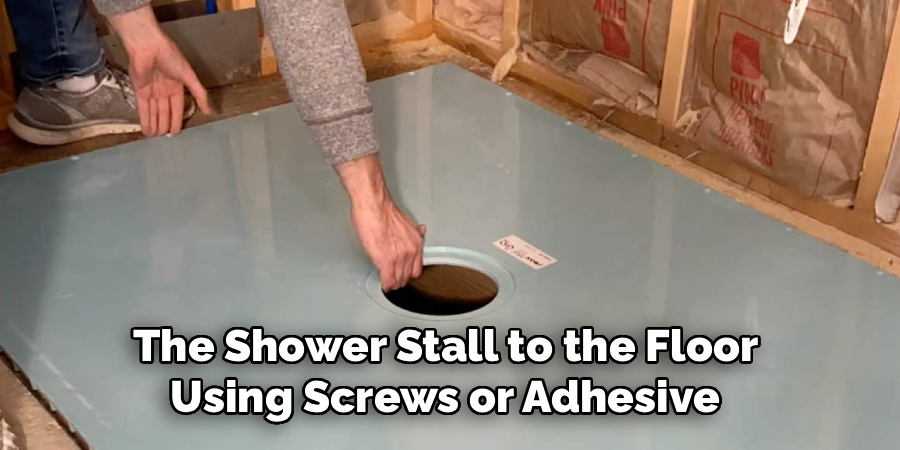 The Shower Stall to the Floor
Using Screws or Adhesive